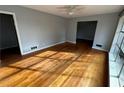 Bright living room with hardwood floors and large windows at 2244 Alpha Dr, Decatur, GA 30032