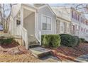 Inviting townhouse entrance with steps and landscaping at 4018 Bayside Cir, Atlanta, GA 30340