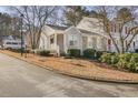 Townhouse with gray siding and stone accents, located on a quiet street at 4018 Bayside Cir, Atlanta, GA 30340