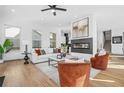 Bright and airy living room features hardwood floors and a modern fireplace at 3378 Bachelor St, Atlanta, GA 30344