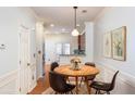 Bright dining room with wood table and four chairs at 887 Commonwealth Se Ave, Atlanta, GA 30312