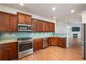 Modern kitchen with granite counters and stainless steel appliances at 887 Commonwealth Se Ave, Atlanta, GA 30312