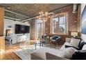Inviting living space boasts exposed brick, large windows, and contemporary furnishings for a cozy atmosphere at 3235 Roswell Ne Rd # 615, Atlanta, GA 30305