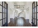 Spacious foyer with hardwood floors and a grand staircase at 1078 Meadow Brook Dr, Woodstock, GA 30188