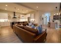 Open floor plan with modern kitchen and leather couch at 1122 Nw Rice Nw St, Atlanta, GA 30318