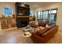 Spacious living room with a fireplace and leather sectional sofa at 1122 Nw Rice Nw St, Atlanta, GA 30318