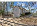 Gray house side view, showing garage and driveway at 1058 Hickory Rd, Canton, GA 30115