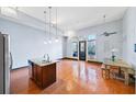 Open floor plan boasts hardwood floors, island kitchen, and access to balcony at 1195 Milton Se Ter # 2305, Atlanta, GA 30315