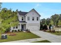 Two-story home with gray siding, blue door, and attached garage at 410 Newland Way, Acworth, GA 30102