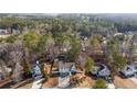 Aerial shot of a home nestled amongst lush trees in a serene residential neighborhood at 1620 Cedar Hl, Douglasville, GA 30134