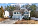 Charming home with two-car garage, green shutters, and well-manicured bushes in the front yard at 1620 Cedar Hl, Douglasville, GA 30134