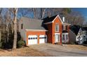 Two-story brick home with a two-car garage at 1495 Gabriel Dr, Lawrenceville, GA 30043