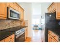 Kitchen with stainless steel appliances and light wood cabinets at 75 E Wesley Ne Rd # 4, Atlanta, GA 30306