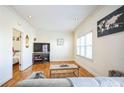 Living room with hardwood floors, large TV and comfortable seating at 75 E Wesley Ne Rd # 4, Atlanta, GA 30306