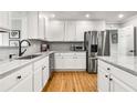 Modern kitchen featuring white cabinets, stainless steel appliances, and granite countertops at 3374 Timber Lake Nw Rd, Kennesaw, GA 30144