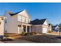 Side view of two story house with white siding and brick accents at 5482 Fountainhead Ln, Auburn, GA 30011