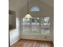 Dining area with bay window and hardwood floors at 11564 Holly Ln, Hampton, GA 30228