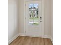 Entry door with clear glass window revealing a view of the exterior at 405 Westmarch Cir, Loganville, GA 30052