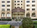 Elegant building entrance with modern glass doors, landscaping, and a designated 'No Parking' area at 2479 Peachtree Ne Rd # 407, Atlanta, GA 30305