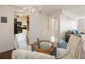 Bright dining area featuring a glass table with seating for four, with a view of the living room and kitchen at 2479 Peachtree Ne Rd # 407, Atlanta, GA 30305