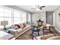 Living room with neutral decor, cozy seating, and large windows at 2745 Fairlane Se Dr, Atlanta, GA 30354