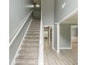 Gray walls, gray carpeting, and light gray vinyl plank flooring at 4332 Abram Dr, Conley, GA 30288