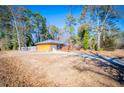 Ranch house with a long driveway and attached garage at 6531 Temple St, Lithia Springs, GA 30122