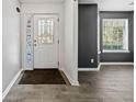 Bright entryway with tile flooring and a decorative glass door at 2885 Field Spring Dr, Lithonia, GA 30058