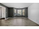 Spacious living room featuring large windows and gray walls at 2885 Field Spring Dr, Lithonia, GA 30058