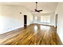 Bright living room with wood floors, ceiling fan, and lots of natural light at 5409 Mill Valley Dr, Douglasville, GA 30135