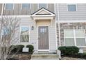 Townhouse features a private entrance with a charming stoop at 871 Ambient Sw Way, Atlanta, GA 30331
