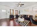 Open concept living area, hardwood floors, and a cozy atmosphere at 871 Ambient Sw Way, Atlanta, GA 30331