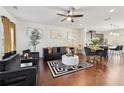 Open concept living space with hardwood floors and stylish furniture at 871 Ambient Sw Way, Atlanta, GA 30331