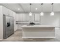 Modern kitchen with a granite counter, stainless steel appliances, and white cabinetry at 1449 Athens Sw Ave, Atlanta, GA 30310