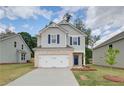 Charming two-story home featuring a brick-accented garage and manicured front lawn at 18 Camellia Dr, Fairburn, GA 30213