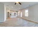 Open concept kitchen with white cabinets and stainless steel appliances at 18 Camellia Dr, Fairburn, GA 30213