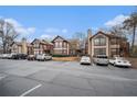 Condo building with parking lot under a clear sky at 813 Dunes Way, Alpharetta, GA 30022