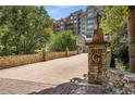 The Greystone condo entrance with stonework and landscaping at 3280 Stillhouse Se Ln # 305, Atlanta, GA 30339