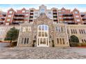 Brick and stone exterior of The Greystone condominium building at 3280 Stillhouse Se Ln # 305, Atlanta, GA 30339