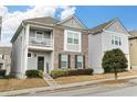 Charming two-story home with a brick facade and a second story balcony, offering curb appeal and outdoor living space at 840 Regal Ln, Atlanta, GA 30331