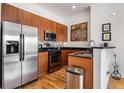 Modern kitchen with stainless steel appliances and wood cabinets at 384 Ralph Mcgill Ne Blvd # 404, Atlanta, GA 30312