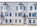 Attractive exterior featuring white brick, dark trim, and private balconies at 1072 Brookglynn Trce, Decatur, GA 30032