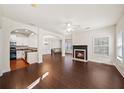 Spacious living room with hardwood floors, fireplace and kitchen view at 4640 Hastings Ter, Alpharetta, GA 30005