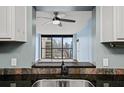 Kitchen features granite countertops and city views at 1280 W Peachtree Nw St # 3306, Atlanta, GA 30309