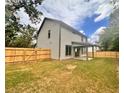 Spacious backyard with a large covered patio and wooden privacy fence at 1679 Eastside Parc St, Atlanta, GA 30316
