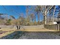 Fenced backyard with grassy area, providing a private outdoor space at 6146 Douglas Manor Ct, Douglasville, GA 30134