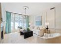 Spacious living room featuring a fireplace and ample natural light at 3636 Habersham Nw Rd # 1108, Atlanta, GA 30305