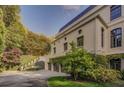 A secluded multi-car garage with lush greenery providing a private driveway for this stunning luxury home at 133 Blackland Nw Rd, Atlanta, GA 30342