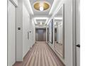 Modern hallway with patterned carpet and large mirrors at 2575 Peachtree Ne Rd # 9G, Atlanta, GA 30305