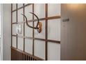 Close-up of wall detail with wood paneling and an antler mount at 2575 Peachtree Ne Rd # 9G, Atlanta, GA 30305